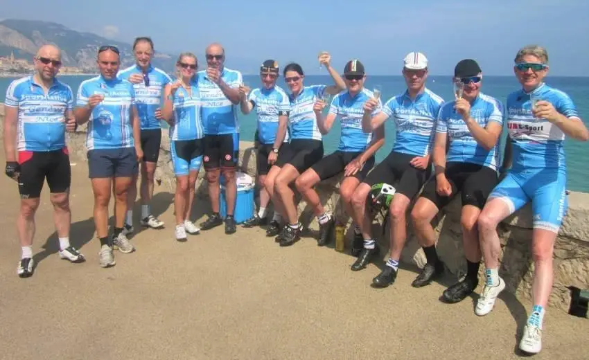 SportActive Cycling Holidays and Training Camps Geneva to Nice riders enjoying a cool glass of champayne by the Med Sea 